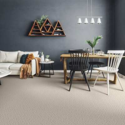 beige floral patterned cut and loop carpet in open living dining space